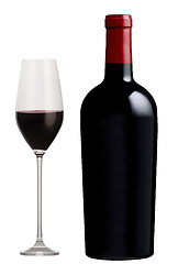 Image showing Glass of red wine and a bottle