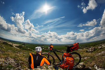 Image showing View of a Young Man With Bicycle on Summer Background.