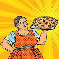 Image showing Old joyful retro woman with berry pie