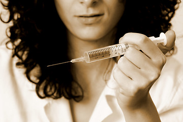 Image showing Portrait of a young doctor with syringa.