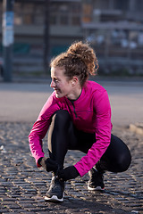 Image showing woman  stretching before morning jogging