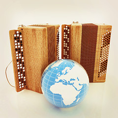 Image showing Musical instruments - retro bayans and Earth. 3D illustration. V