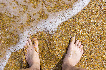 Image showing Barefoot on sea surf sand