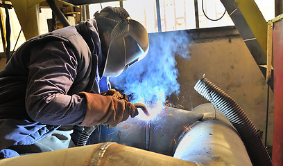 Image showing woman welder welding