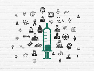 Image showing Healthcare concept: Syringe on wall background