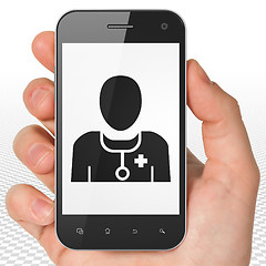 Image showing Health concept: Hand Holding Smartphone with Doctor on display