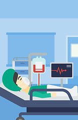 Image showing Patient lying in hospital bed with heart monitor.