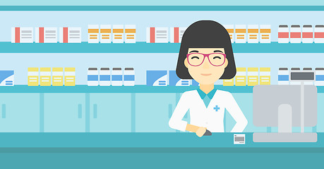 Image showing Pharmacist at counter with computer monitor.