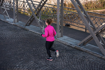 Image showing sporty woman jogging on morning