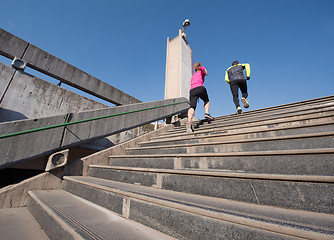 Image showing young  couple jogging on steps