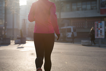 Image showing sporty woman jogging on morning