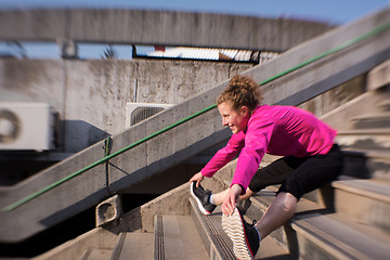 Image showing woman  stretching before morning jogging