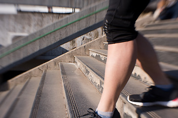 Image showing woman jogging on  steps