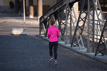 Image showing sporty woman jogging on morning