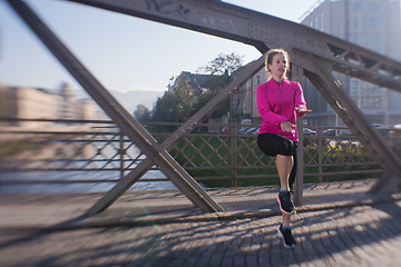 Image showing woman  stretching before morning jogging