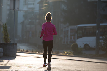 Image showing sporty woman jogging on morning