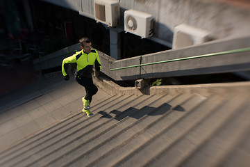 Image showing man jogging on steps