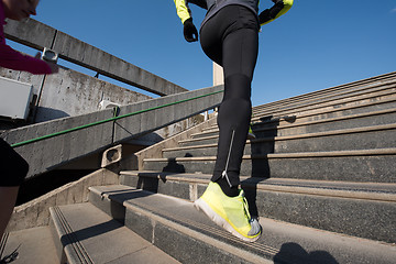 Image showing young  couple jogging on steps