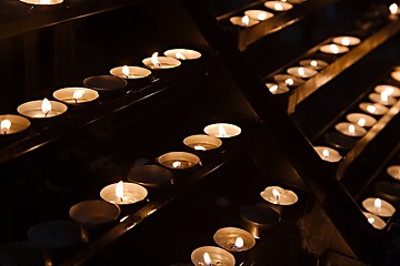 Image showing Candles in a dark church