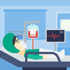 Image showing Patient lying in hospital bed with heart monitor.