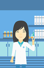 Image showing Laboratory assistant with syringe in lab.