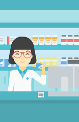 Image showing Pharmacist showing some medicine.