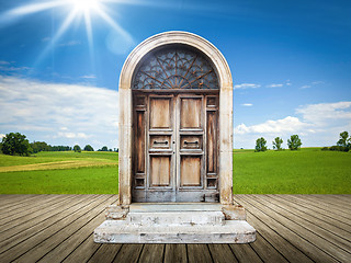 Image showing landscape with an old door