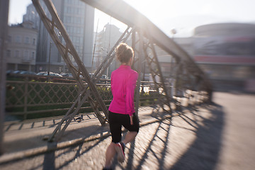 Image showing sporty woman jogging on morning