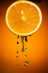 Image showing One half of orange isolated on colorful background