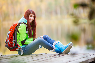 Image showing Long-haired brunette with backpack