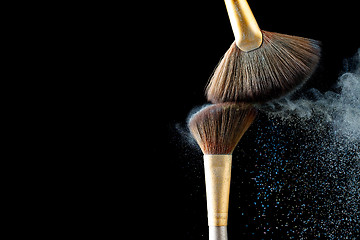 Image showing Professional brushes for powder and blush isolated on black background