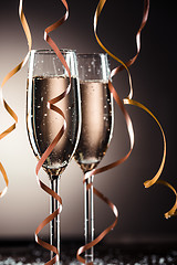 Image showing Stylish image of two champagne glasses and ribbons for decoration