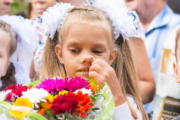 Image showing First grader on the first line in September picking his nose