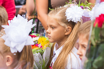 Image showing First grader standing in a crowd of children on line the first of September