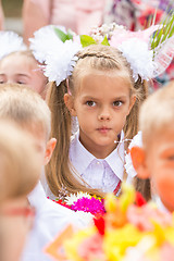 Image showing Thoughtful first grader in the crowd of classmates on line the first of September