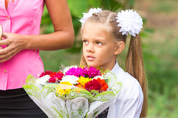 Image showing Portrait of a seven-year schoolgirl, standing next to my mother