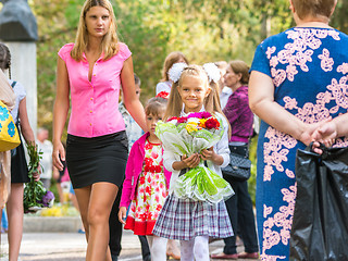 Image showing First grader goes to school with his mother and younger sister