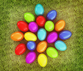 Image showing Colored Easter eggs on a green grass. 3D illustration. Vintage s