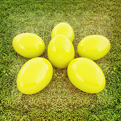 Image showing Yellow Easter eggs as a flower on a green grass. 3D illustration