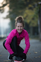 Image showing woman  stretching before morning jogging