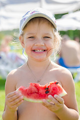 Image showing Funny cheerful girl eating watermelon, close-up portrait