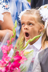 Image showing First grader yawning on line the first of September