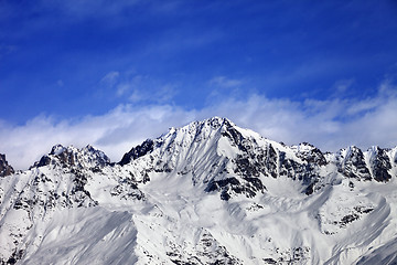 Image showing Snow mountains in winter sun day and blue sky with clouds