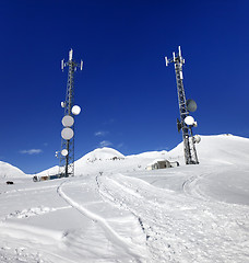 Image showing Ratrac ski road and satellite dishes at nice sun day