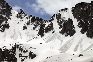 Image showing Snow rocks with traces from avalanche in sun spring day