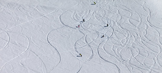 Image showing Panoramic view on snowboarders and skiers downhill on off piste 