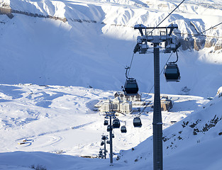 Image showing Gondola lift on ski resort at winter sun evening