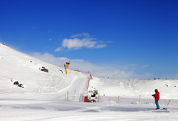 Image showing Skier on snow ski slope at sun day