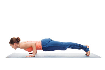 Image showing Woman doing Ashtanga Vinyasa Yoga asana Chaturanga Dandasana