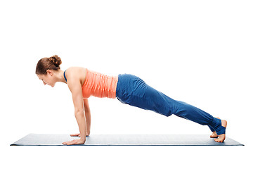 Image showing Woman doing yoga asana Utthita chaturanga dandasana (or phalakasana)